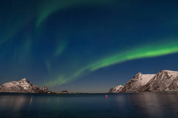 Dramatic polar lights, Aurora borealis over the mountains in the North of Europe - Lofoten islands, Norway