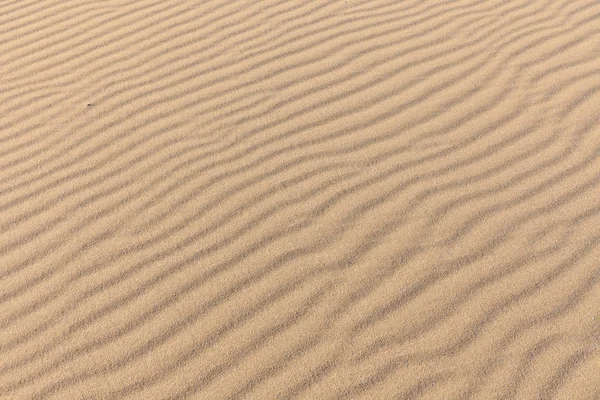 Sandstruktur. Hintergrund aus feinem Sand. Sandhintergrund. Selektiver Fokus — Stockfoto