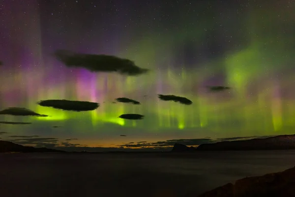 Dramatic polar lights, Aurora borealis over the mountains in the North of Europe - Lofoten islands, Norway