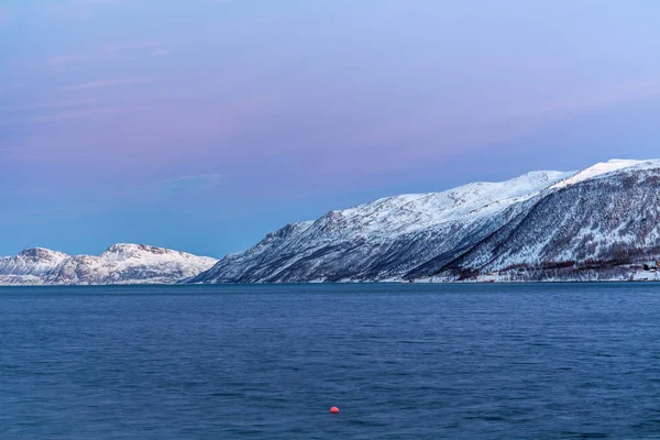 Amazing sunset with amazing magenta color over fjord Tromso, Norway. Polar night. long shutter speed — Stock Photo, Image