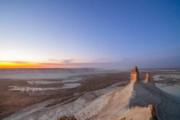 Sunrise over Ustyurt Plateau. District of Boszhir. The bottom of a dry ocean Tethys. Kazakhstan. selective focus
