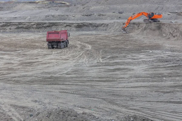 Construction machinery works on quarry mining in the Khibiny mountains, Kola Peninsula.