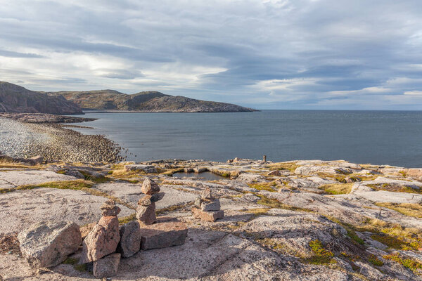 Colorful rocky landscape of northern tundra in autumn season. Wild nature of Russian North near Teriberka. Kola Peninsula, Murmansk Oblast, Russia