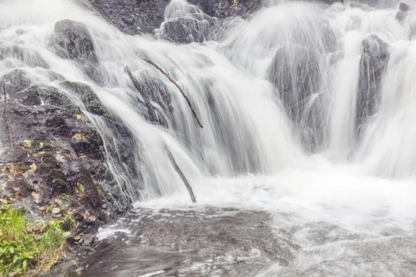 A waterfall in a forest in central Sweden photographed by a long exposure.