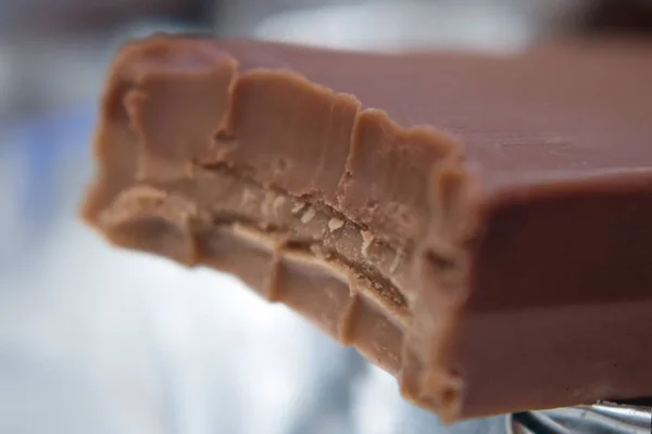 Food photography of a creamy chocolate bar with a bite taken