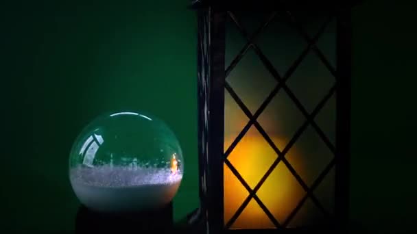 Spinning Christmas Lantern Snow Globe Dark Green Background Snow Falls — ストック動画