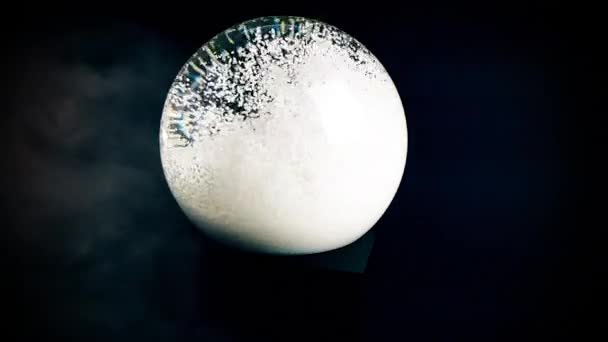 Spinning Snow Ball Black Background Slow Motion Snow Globe Enveloped — Stock Video