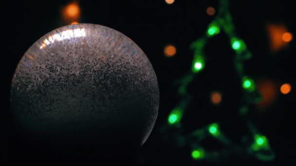 Christmas Snow Globe Animation Hand Christmas Tree Glows Background — ストック動画