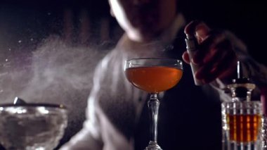 The bartender is preparing a cocktail 