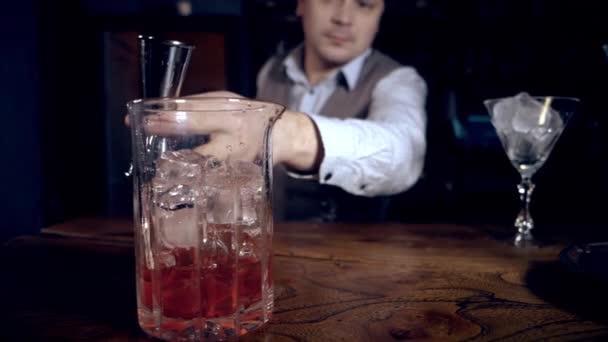 Bartender Makes Cocktail Pouring Whiskey Tequila Jigger Mixing Glass Ice — Stock Video