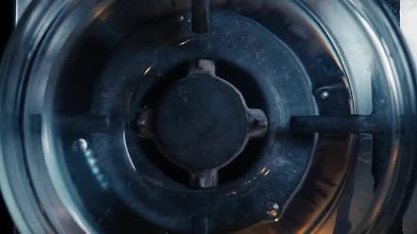 A close-up of a gas cooking ring being lit. — Stock Video