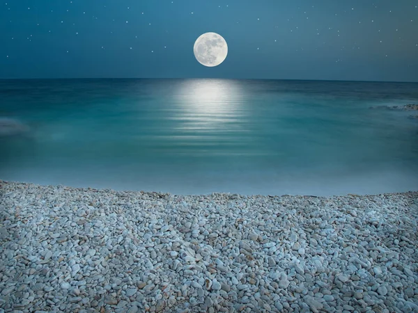 Moonlight on the pebble beach