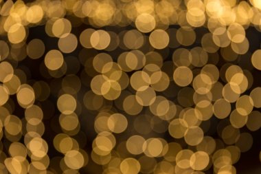 Bokeh odaklı ışıklarla altın soyut arkaplan
