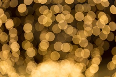 Bokeh odaklı ışıklarla altın soyut arkaplan