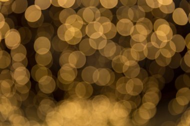 Bokeh odaklı ışıklarla altın soyut arkaplan