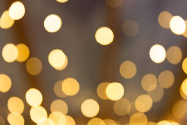 Bokeh odaklı ışıklarla altın soyut arkaplan