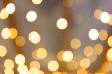 Bokeh odaklı ışıklarla altın soyut arkaplan