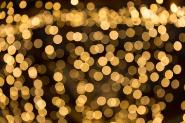 Bokeh odaklı ışıklarla altın soyut arkaplan