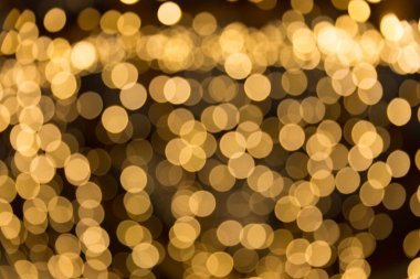 Bokeh odaklı ışıklarla altın soyut arkaplan