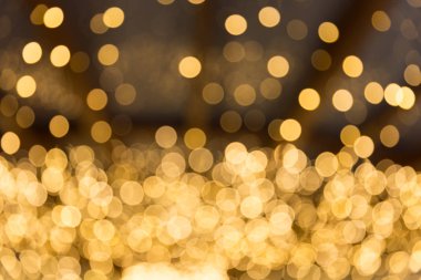 Bokeh odaklı ışıklarla altın soyut arkaplan