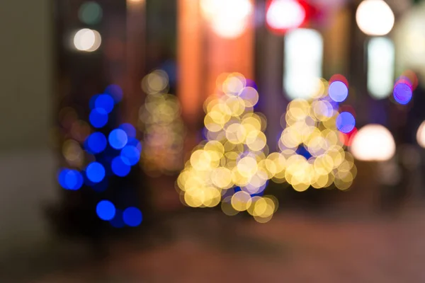 Christmas trees on street blurry background with bokeh