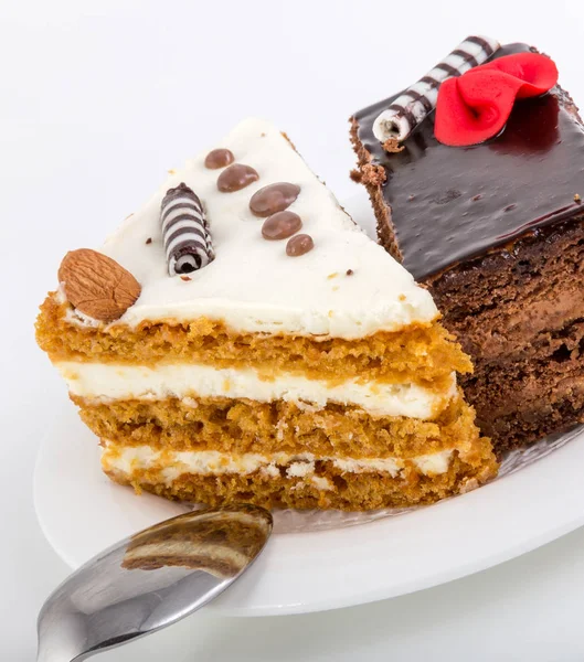 Two pieces of tasty cake on white saucer — Stock Photo, Image