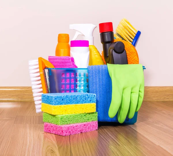 Set of cleaning equipment on a wooden floor — Stock Photo, Image