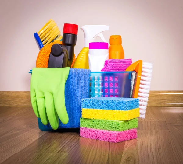 Set of cleaning equipment on a wooden floor — Stock Photo, Image