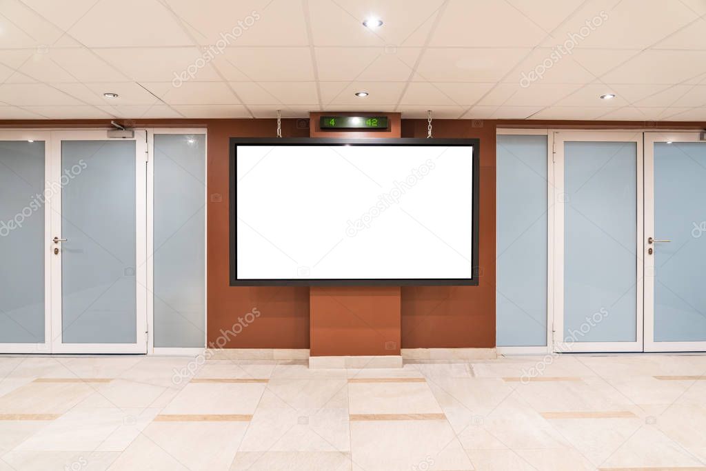 Blank big monitor in public place. Billboard mockup near doors in shopping center, airport terminal, office building so many people can see
