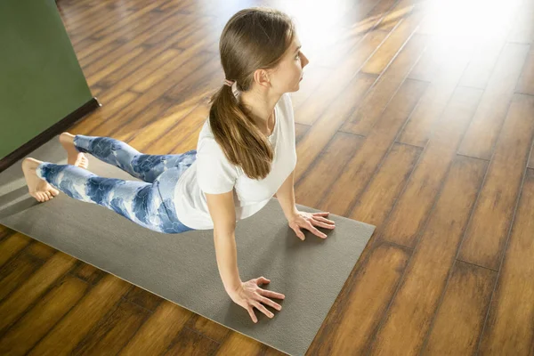Fitness, sport, training and lifestyle concept - woman stretching on mat in gym — Stock Photo, Image