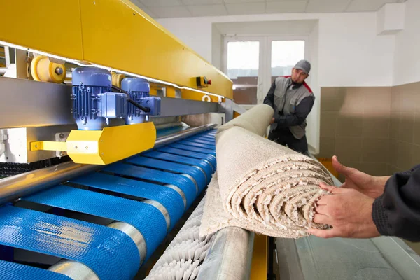 Laundry workers in the process of working on automatic machine for carpet washing in dry cleaning — Stock Photo, Image