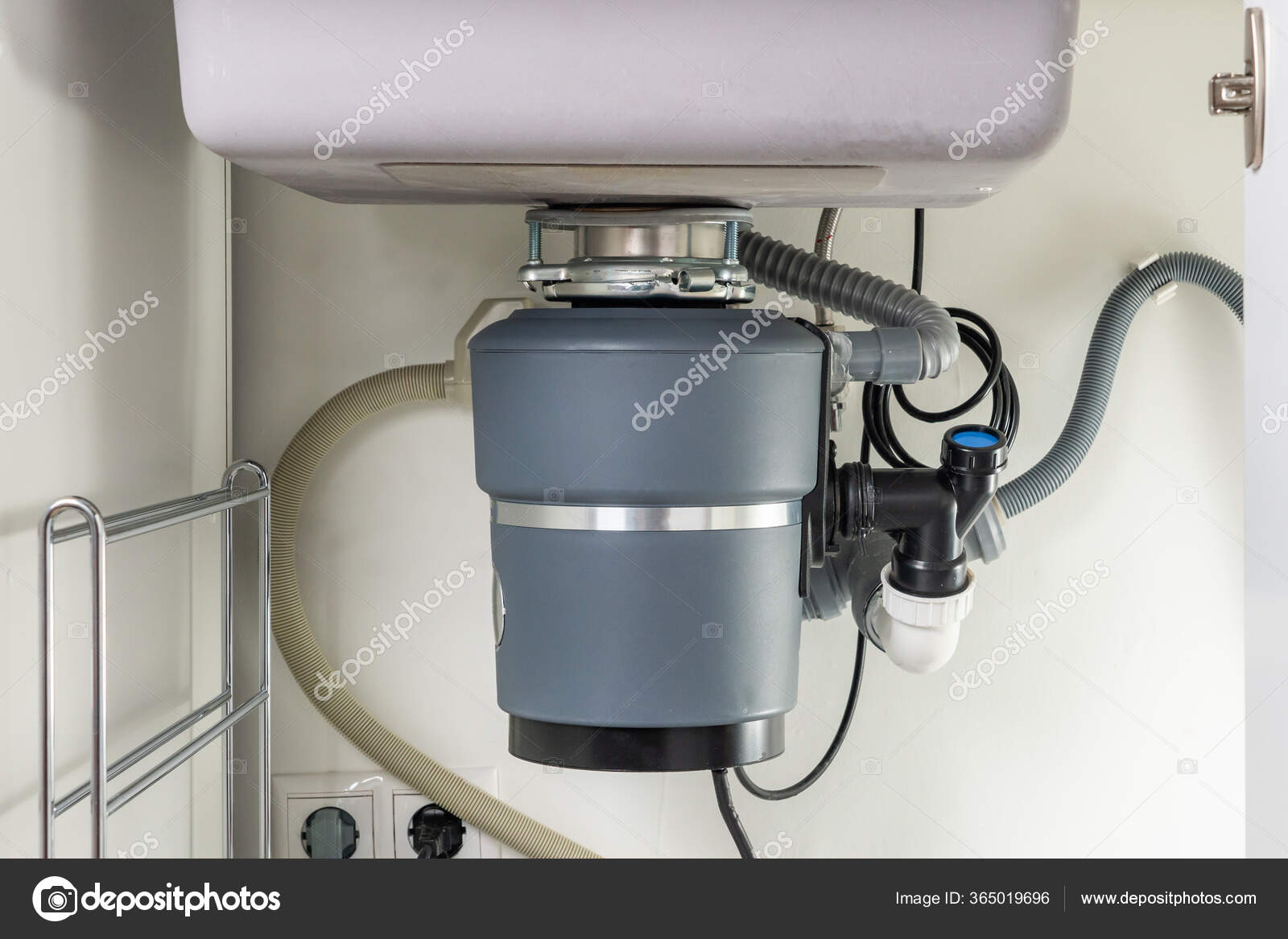 Garbage Disposal under the modern sink, waste chopper concept Stock
