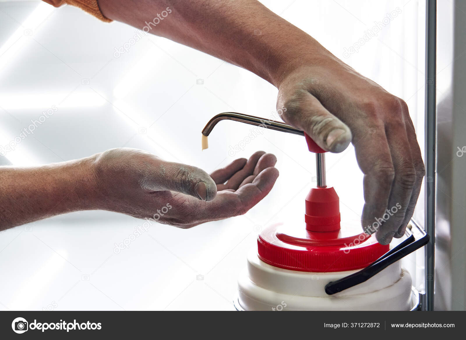 Mechanic applying washing soap to clean dirty hands after work Stock Photo  by ©mariakray 371272872