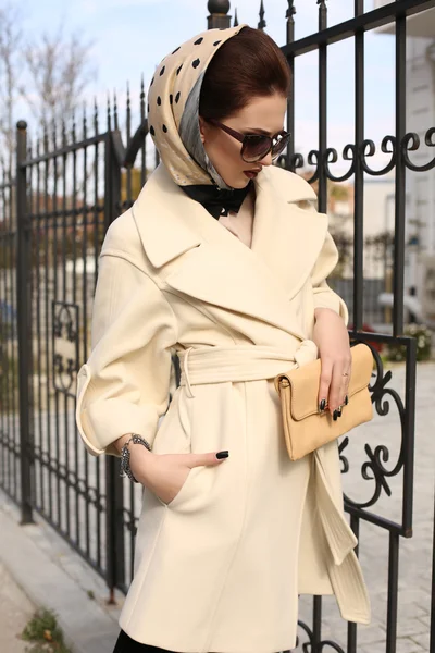 Gorgeous sensual woman with dark hair in elegant luxurious coat — Stock Photo, Image