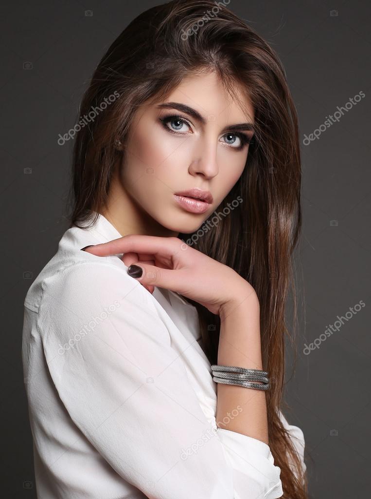 Beautiful Woman With Long Dark Hair In Elegant Clothes With