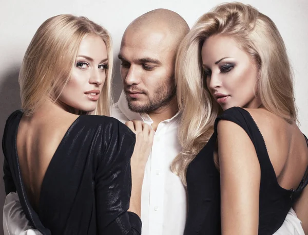 Sexy gorgeous women with blond hair posing with handsome man — Stock Photo, Image