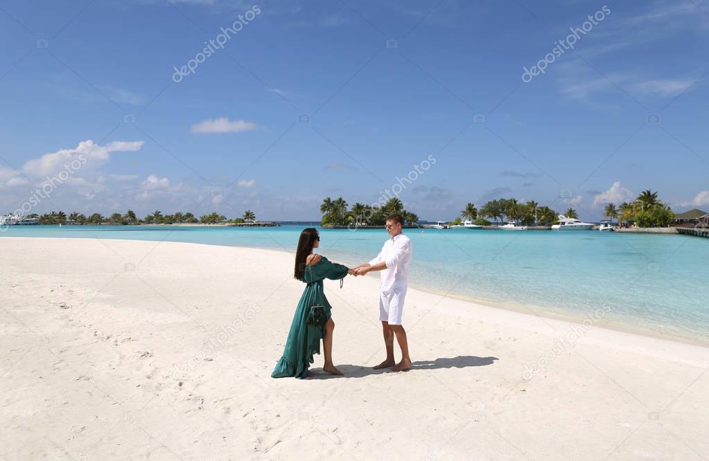  love story photo of beautiful couple relaxing in Maldives islan