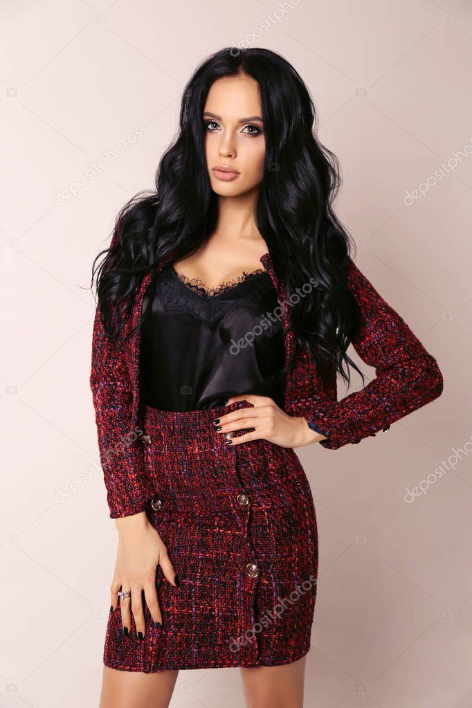 beautiful sensual woman with long dark hair in elegant clothes 