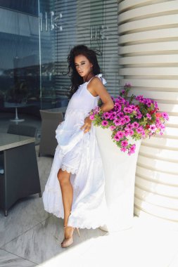 beautiful sensual woman with dark hair in elegant dress posing o