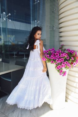 beautiful sensual woman with dark hair in elegant dress posing o