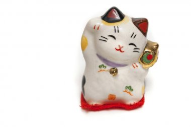 Maneki-neko, şanslı kedi ile bir dik pençe, Japon hediye izole çağırıyor,