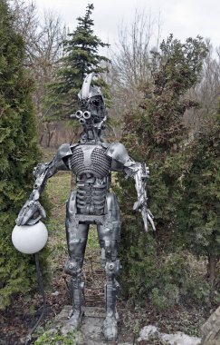 Street lamppost made as a steampunk decorative statue in the yard of Ark (Kovhceg) famous bar in Ternopil, Ukraine