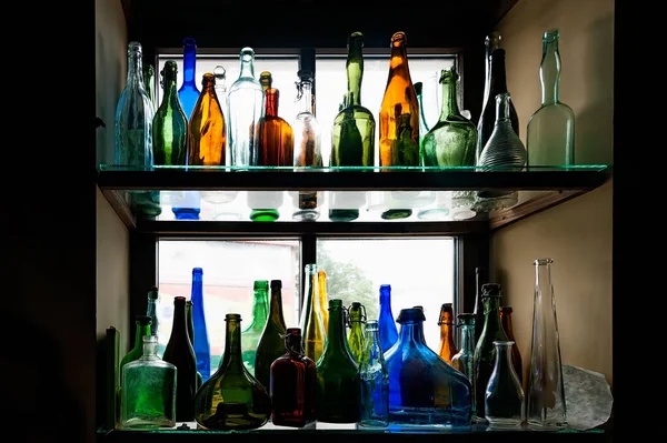 Stack Colorful Bottles Windowsill — Stock Photo, Image