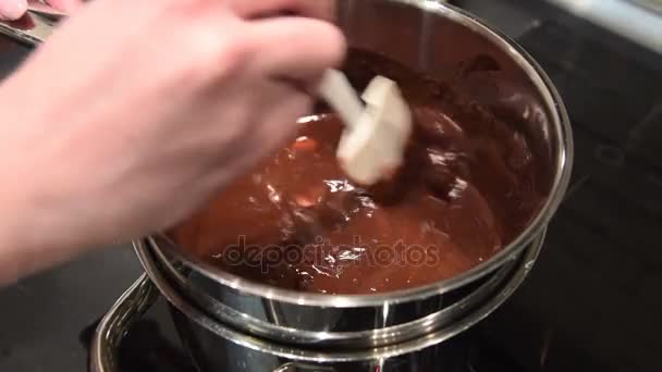 Chocolate and butter melting on water bath — Stock Video