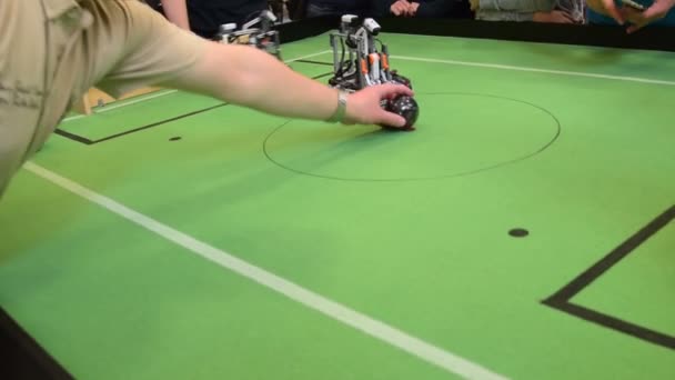 Shooting a goal during robots football game — Stock Video