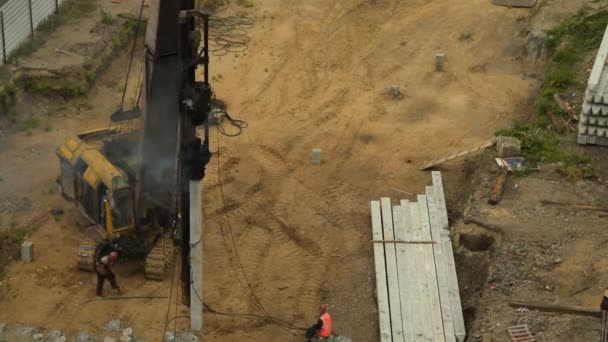 Pile driving for building foundation — Stockvideo