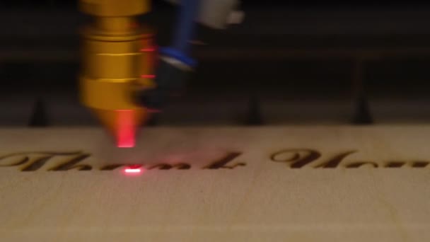 Engraving text on wood with laser — Stok video