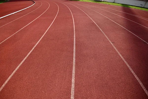 Red running tracks in sport stadium