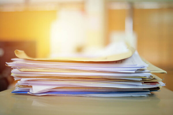 stack of colorful books on the table