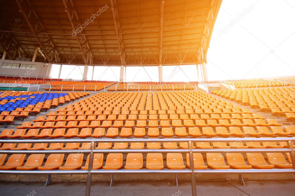 Stadiums and empty seats and have an orange light like the sun.